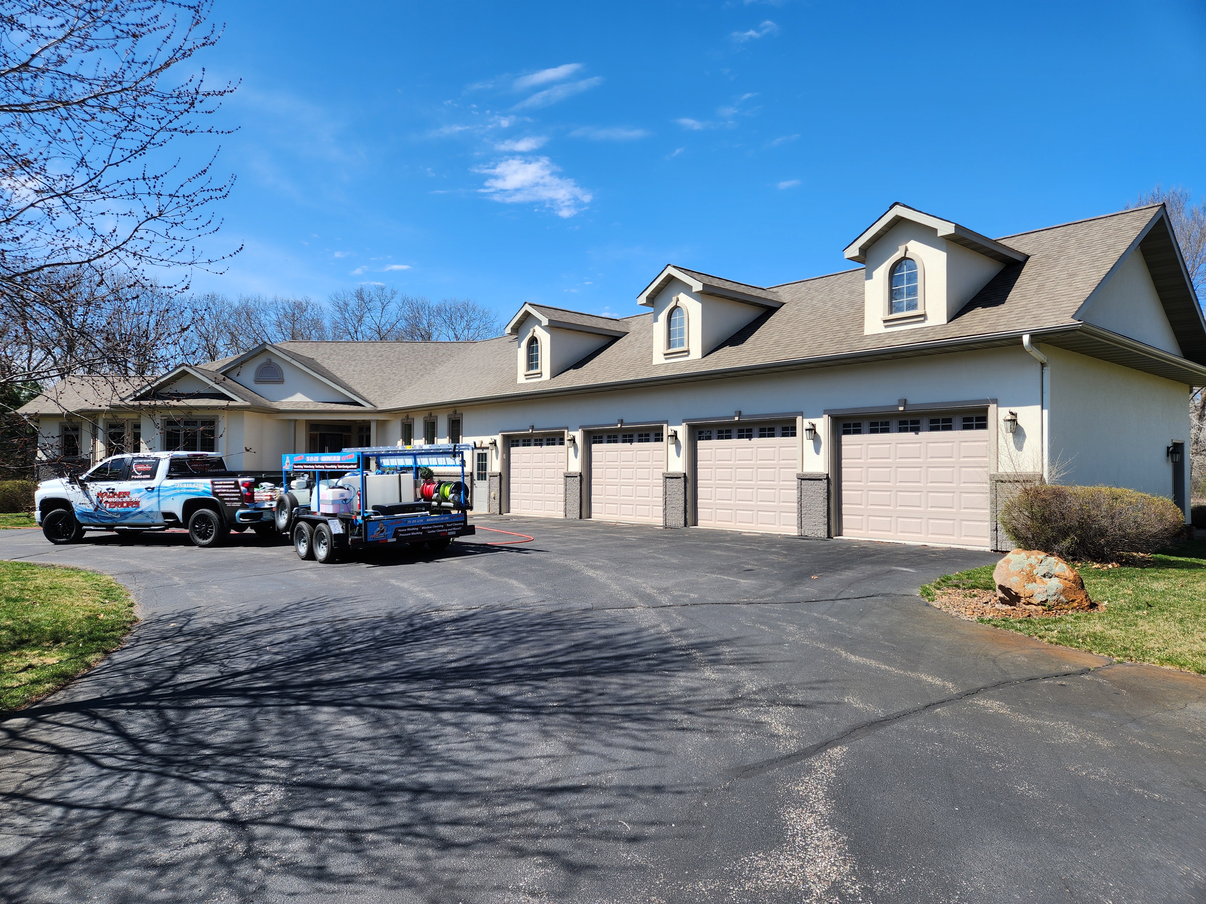 Professional House Washing in Eau Claire, WI on this Stucco Home Using a Soft Washing Process